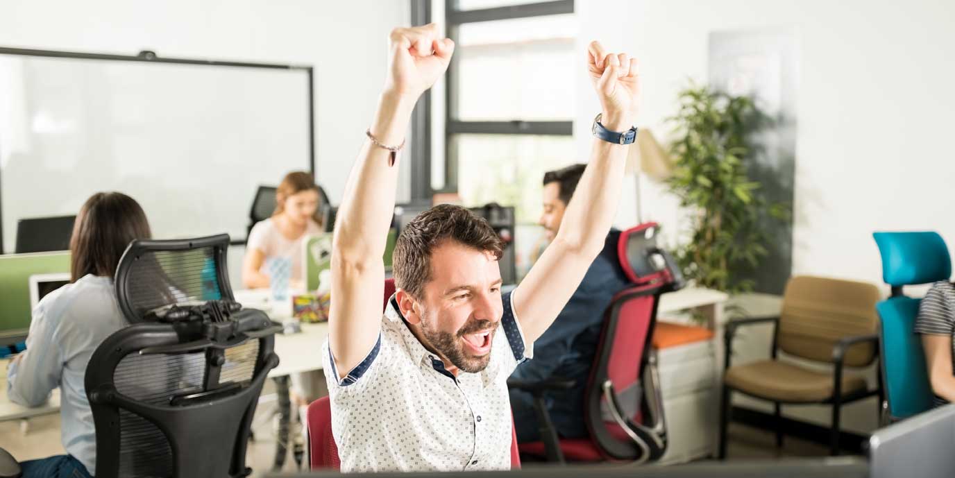 Employee cheers out in excitement over their productivity and error-free results